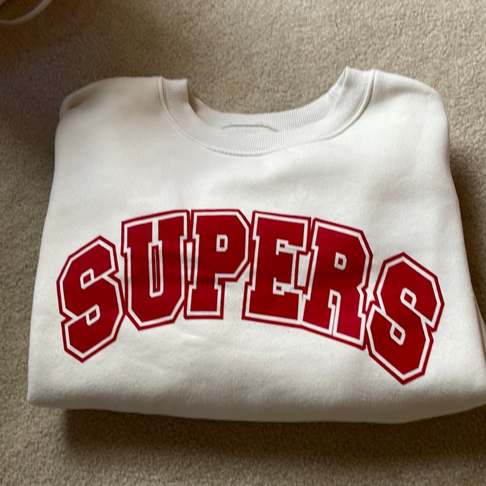 This is a pull over, it’s a size small and an off white color.